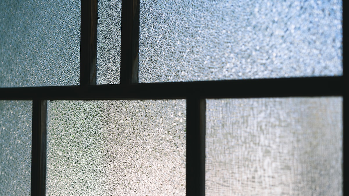 Window glass with reflective film applied for energy insulation