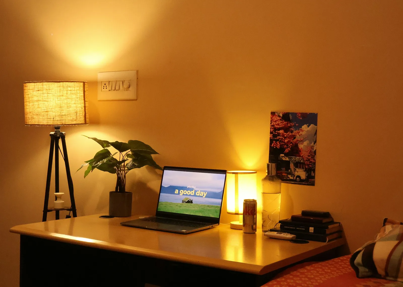 A cozy home office corner at dusk with a small computer running quietly under a desk, soft status light glowing