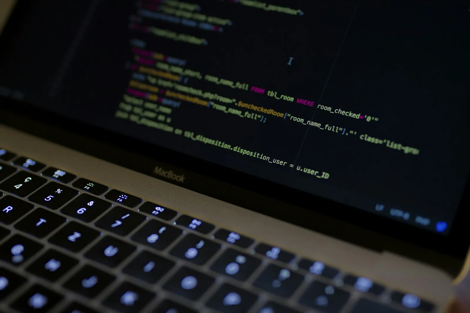 Close-up of a terminal window showing a Docker Compose file, soft desk lamp light
