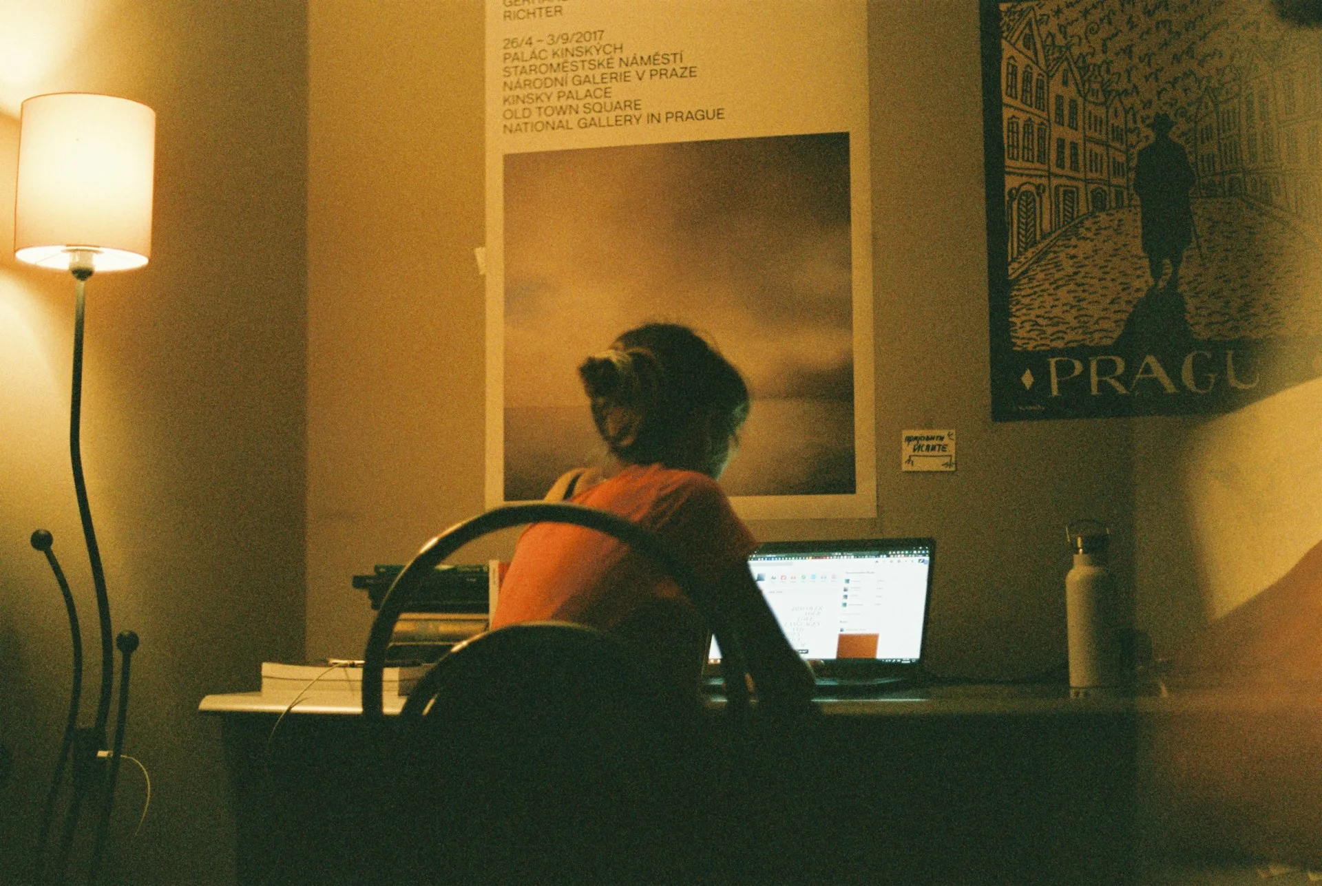 A laptop on a home desk in the evening running a local AI chat application